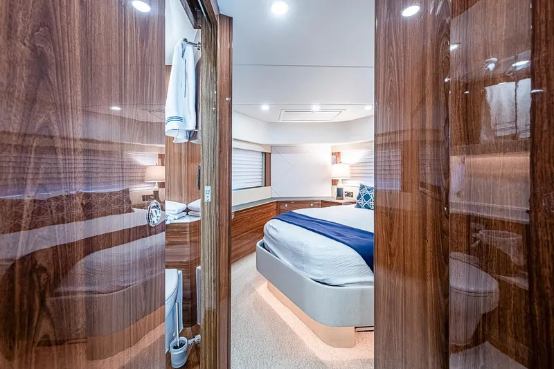 Slide: The Image of Luxurious Maritimo M75 yacht bedroom interior with elegant wood finishes, 2025 model. - 84