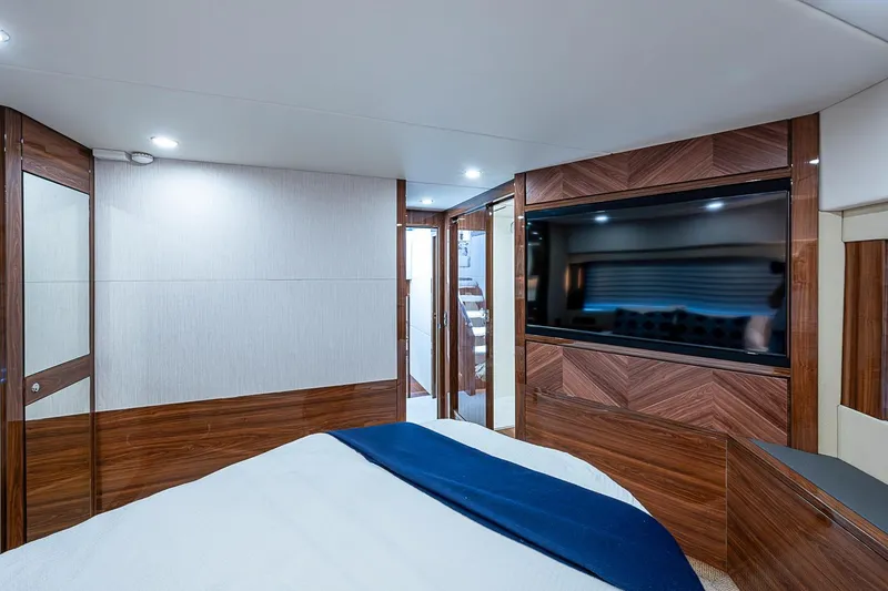 Slide: The Image of Luxurious interior of 2025 Maritimo M75 yacht with modern wood paneling and large TV. - 88