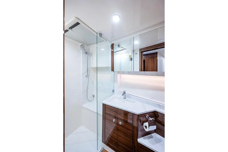 Slide: The Image of Luxurious bathroom in 2025 Maritimo M75 yacht with modern fixtures and elegant wood cabinetry. - 89