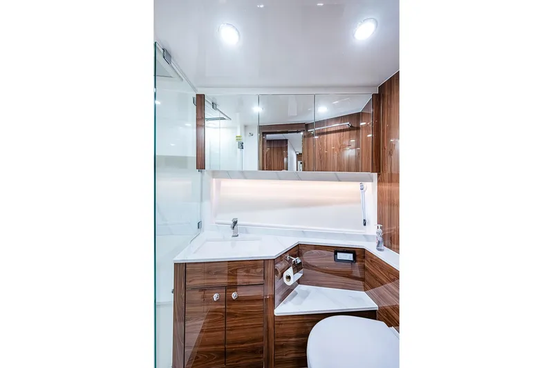 Slide: The Image of Luxurious bathroom interior of 2025 Maritimo M75 yacht with modern wood finishes. - 90