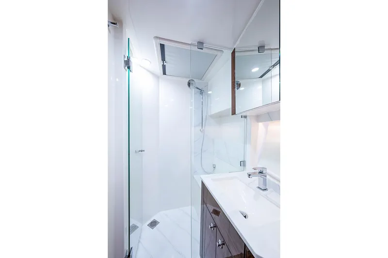 Slide: The Image of Luxurious bathroom in 2025 Maritimo M75 yacht with modern fixtures and glass shower. - 92