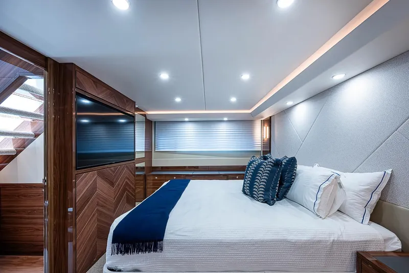 Slide: The Image of Luxurious Maritimo M75 2025 yacht bedroom with modern design and elegant lighting. - 95