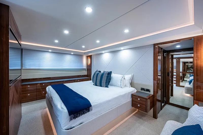 Slide: The Image of Luxurious bedroom interior of 2025 Maritimo M75 yacht with elegant wood finishes. - 96