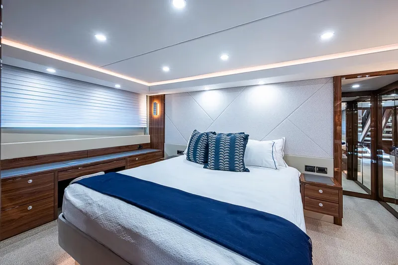 Slide: The Image of Luxurious bedroom interior of 2025 Maritimo M75 yacht with modern design and elegant lighting. - 97