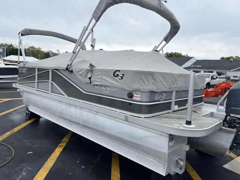 Slide: The Image of 2018 G3 V322 SS pontoon boat with gray cover on parking lot. - 21