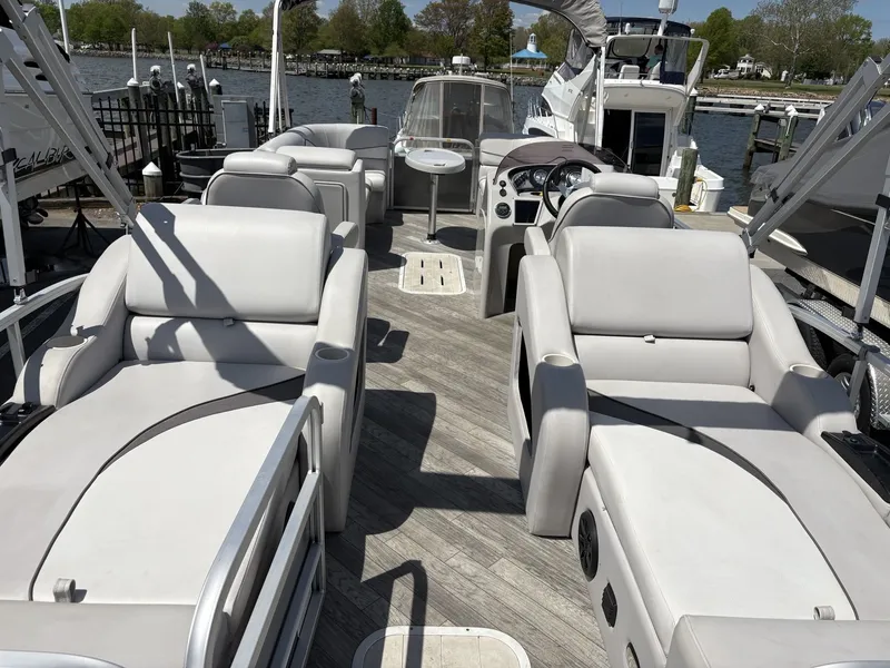 Slide: The Image of 2018 G3 V322 SS pontoon boat with luxurious lounge seating at dock. - 7