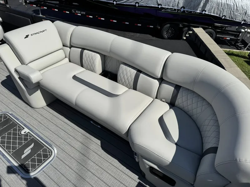 Slide: The Image of Luxurious seating in Starcraft RX 25 R DH boat, model year 2026. - 14