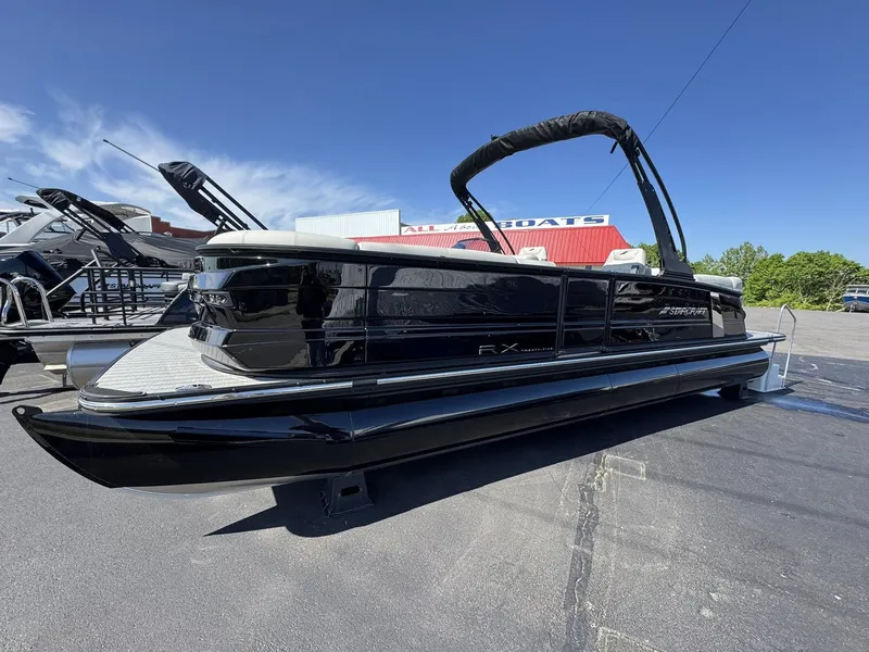 Slide: The Image of 2026 Starcraft RX 25 R DH pontoon boat on parking lot. - 21