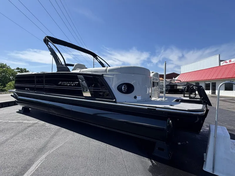 Slide: The Image of 2026 Starcraft RX 25 R DH pontoon boat on parking lot. - 22