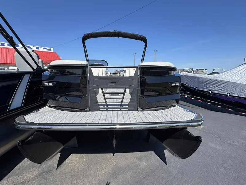 Slide: The Image of 2026 Starcraft RX 25 R DH pontoon boat in a parking lot. - 3