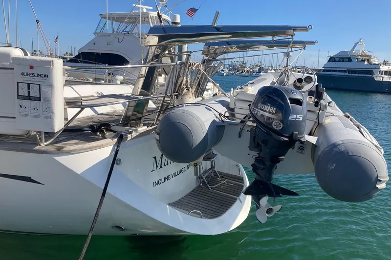 Slide: The Image of Oyster 56 Deck Saloon yacht with Yamaha motor, docked in a marina, 2008 model. - 6