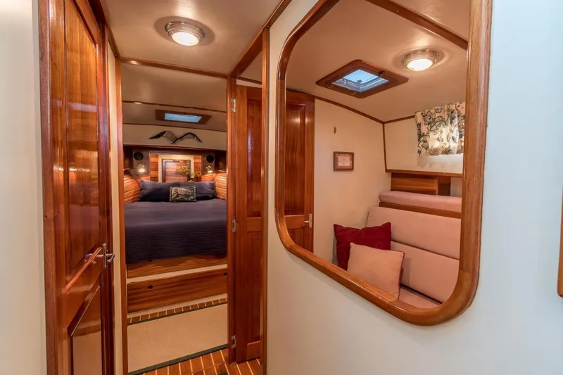 Slide: The Image of Luxurious interior of 2000 Duffy 42 boat with cozy bedroom and elegant wood finishes. - 11
