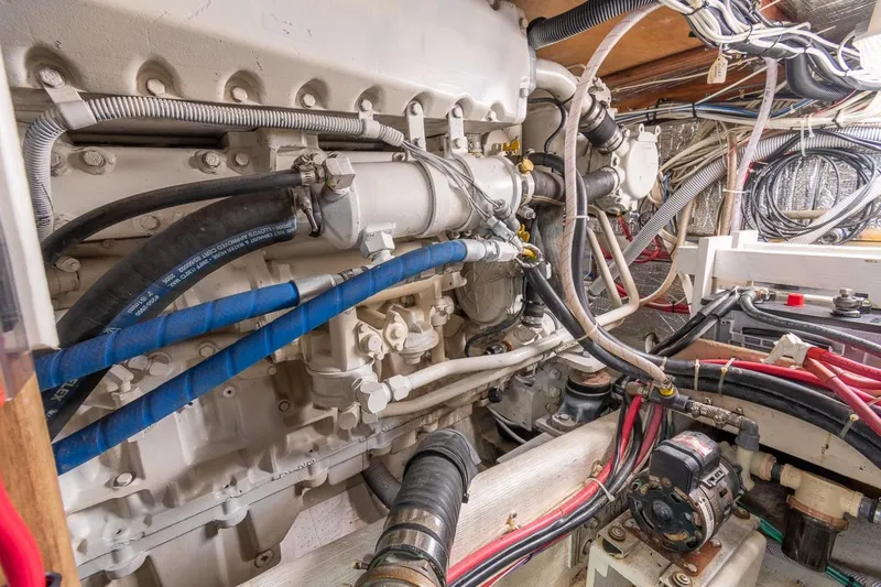 Slide: The Image of Engine room of a 2000 Duffy 42 boat, showcasing complex machinery and wiring. - 14