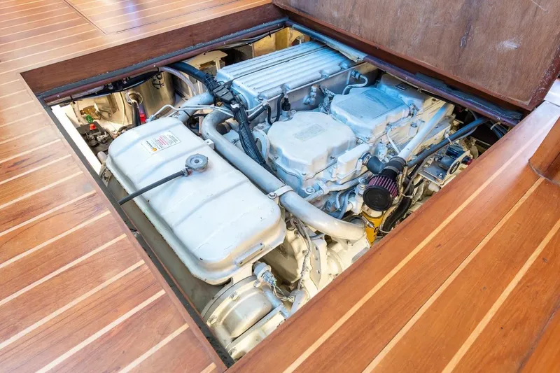 Slide: The Image of Engine compartment of a 2000 Duffy 42 boat, showcasing detailed mechanical components. - 17
