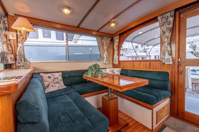 Slide: The Image of Luxurious interior of 2000 Duffy 42 boat with plush seating and elegant decor. - 8
