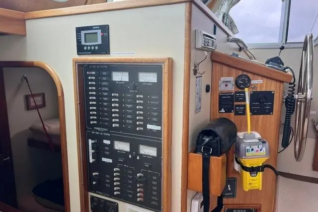 Slide: The Image of Control panel and navigation equipment inside a 2000 Duffy 42 boat cabin. - 28