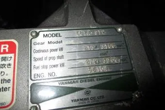 Slide: The Image of Close-up of a Yanmar diesel engine plate on a 2007 Mariner 40 Orient. - 57