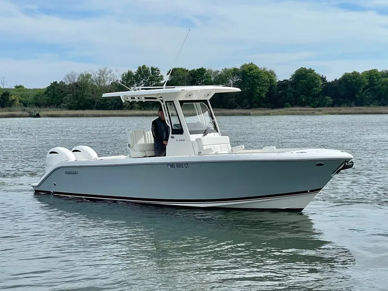 The Image of 2022 Pursuit S 268 Sport boat on calm water. - 0