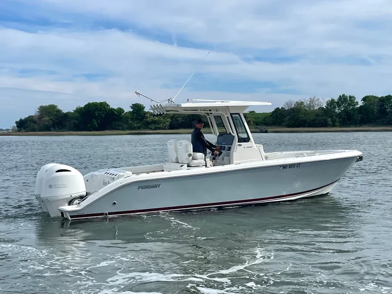 Slide: The Image of 2022 Pursuit S 268 Sport boat on calm water. - 10