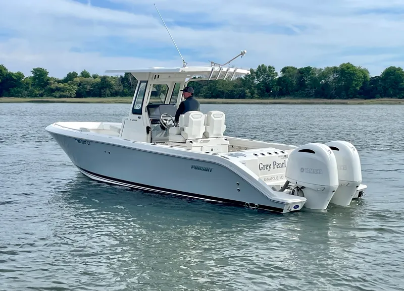 Slide: The Image of 2022 Pursuit S 268 Sport boat on calm water. - 13