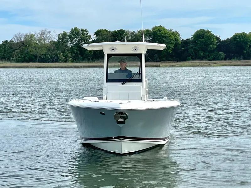 Slide: The Image of 2022 Pursuit S 268 Sport boat on calm water. - 14