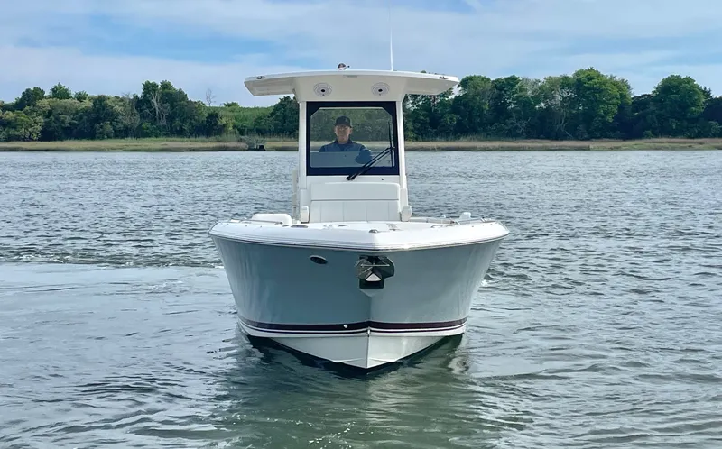 Slide: The Image of 2022 Pursuit S 268 Sport boat on calm water. - 2