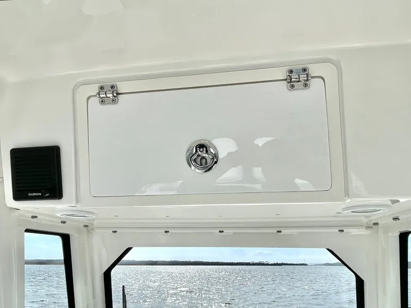 Slide: The Image of Interior view of 2022 Pursuit S 268 Sport with storage compartment. - 23