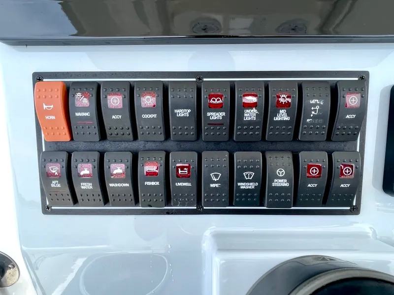Slide: The Image of Control panel of 2022 Pursuit S 268 Sport with various switches. - 24