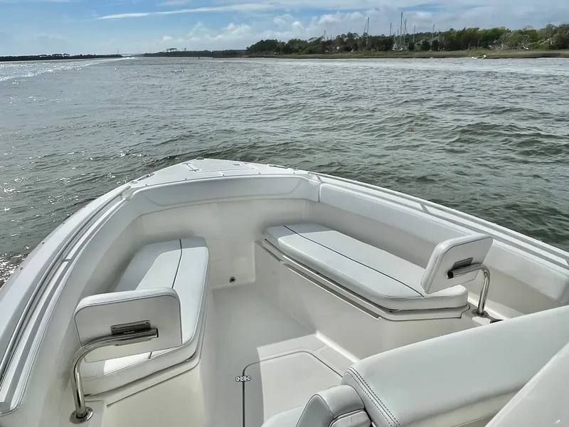 Slide: The Image of 2022 Pursuit S 268 Sport boat on calm waters. - 28