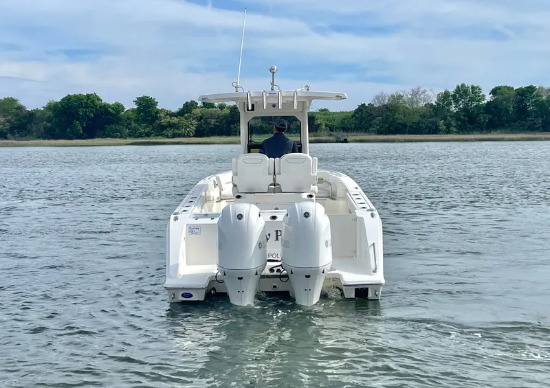 Slide: The Image of 2022 Pursuit S 268 Sport boat on calm water. - 3