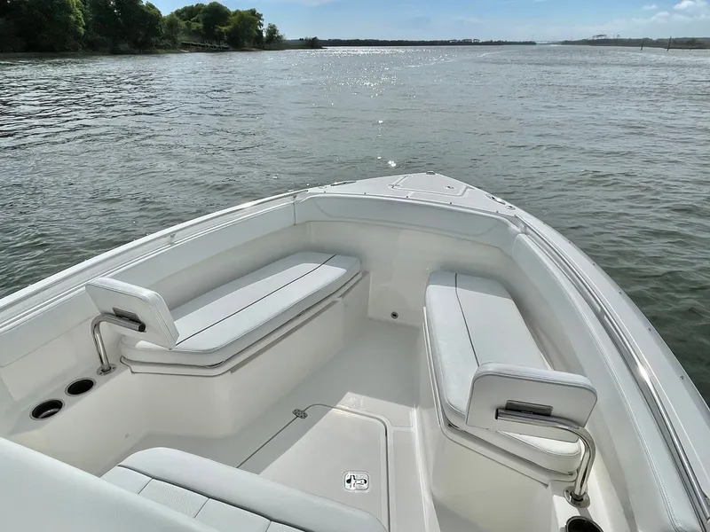 Slide: The Image of 2022 Pursuit S 268 Sport boat on calm water. - 30