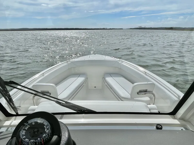 Slide: The Image of Pursuit S 268 Sport 2022 on calm waters under sunny skies. - 31