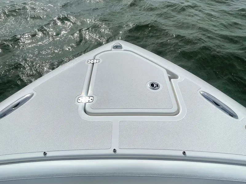 Slide: The Image of Bow of Pursuit S 268 Sport 2022 on the water. - 37
