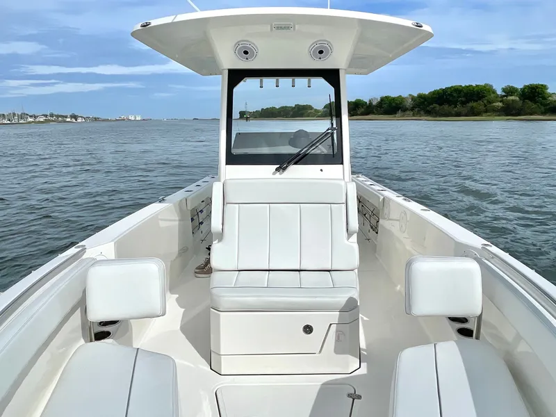 Slide: The Image of 2022 Pursuit S 268 Sport boat on calm waters. - 41