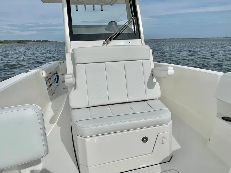 Slide: The Image of 2022 Pursuit S 268 Sport boat on calm water. - 43