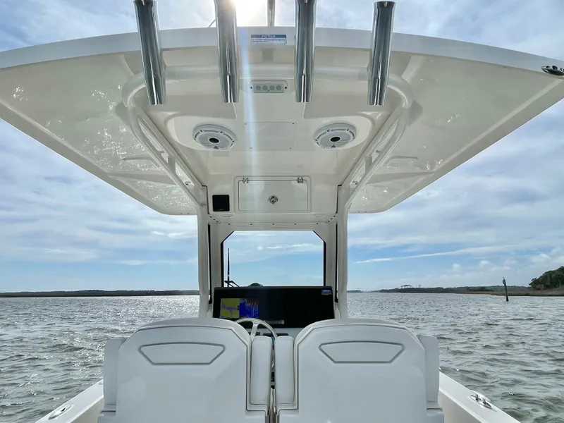 Slide: The Image of Interior view of Pursuit S 268 Sport boat, 2022 model, on the water. - 46