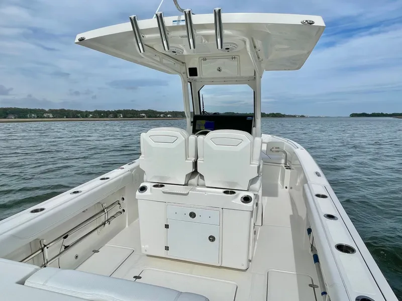 Slide: The Image of 2022 Pursuit S 268 Sport boat on calm waters. - 48