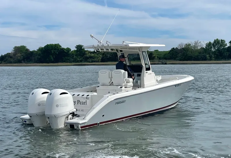 Slide: The Image of 2022 Pursuit S 268 Sport boat on calm water. - 9
