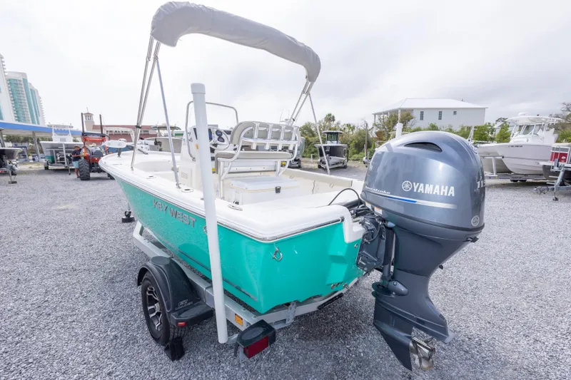 Slide: The Image of 2023 Key West 188 Bay Reef boat with Yamaha outboard motor on a trailer. - 10