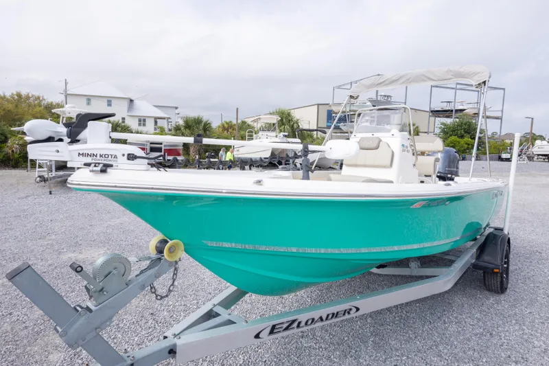 Slide: The Image of 2023 Key West 188 Bay Reef boat on trailer, featuring Minn Kota motor. - 13