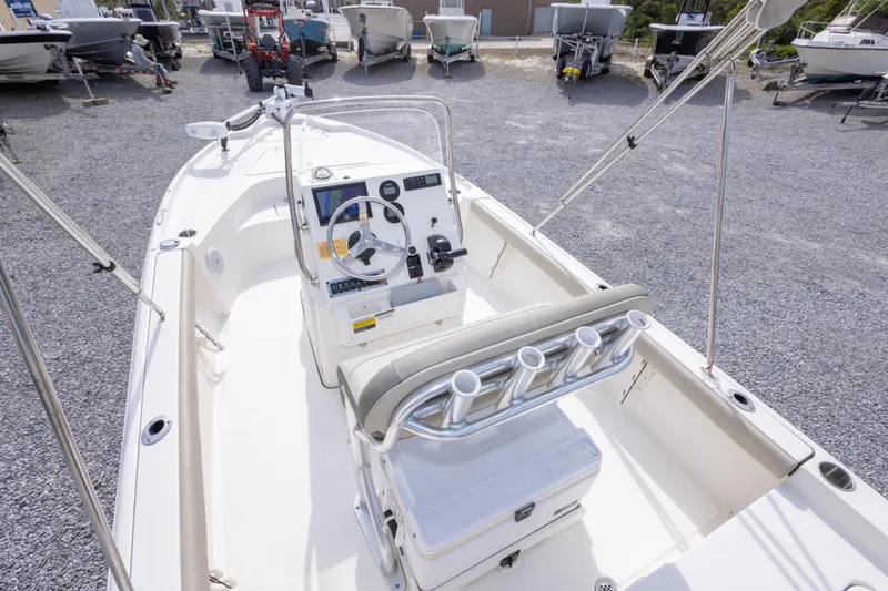 Slide: The Image of 2023 Key West 188 Bay Reef boat interior with steering console and rod holders. - 16