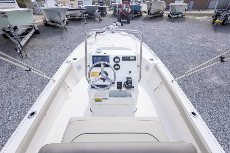 Slide: The Image of 2023 Key West 188 Bay Reef boat interior with steering console and controls. - 17