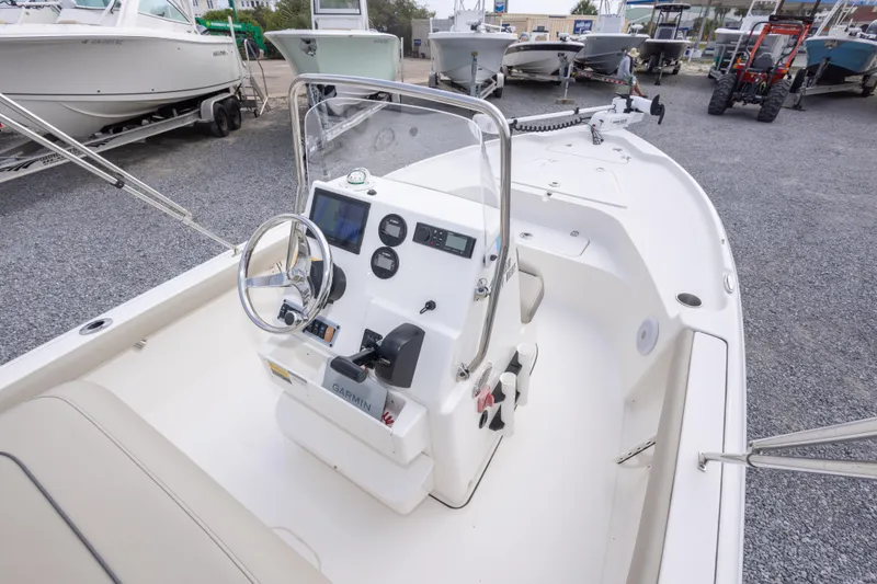 Slide: The Image of 2023 Key West 188 Bay Reef boat interior with steering console and navigation equipment. - 20