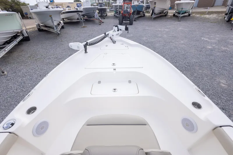 Slide: The Image of 2023 Key West 188 Bay Reef boat on gravel lot, surrounded by other boats. - 22