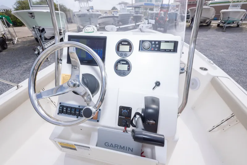 Slide: The Image of 2023 Key West 188 Bay Reef boat console with Garmin navigation and Yamaha controls. - 23