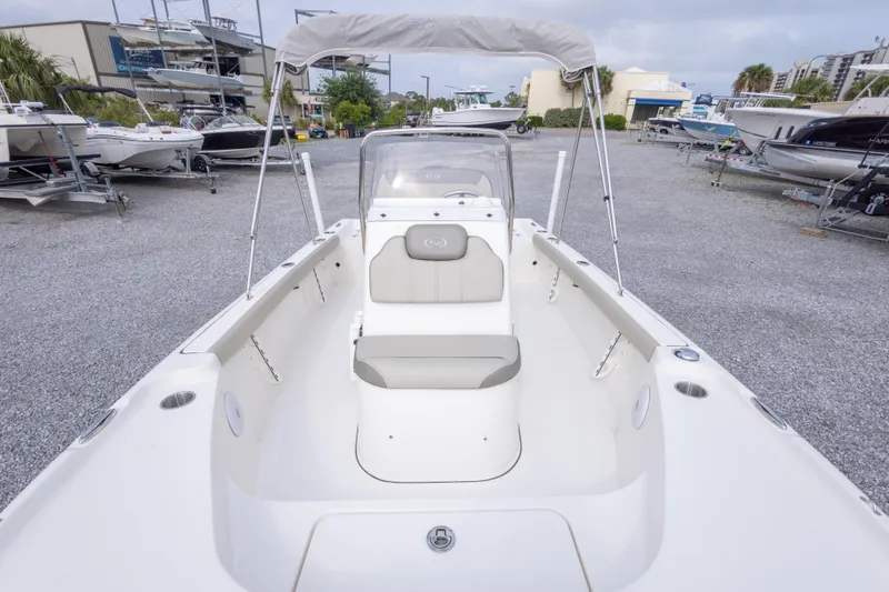 Slide: The Image of 2023 Key West 188 Bay Reef boat with seating, parked in a marina. - 28