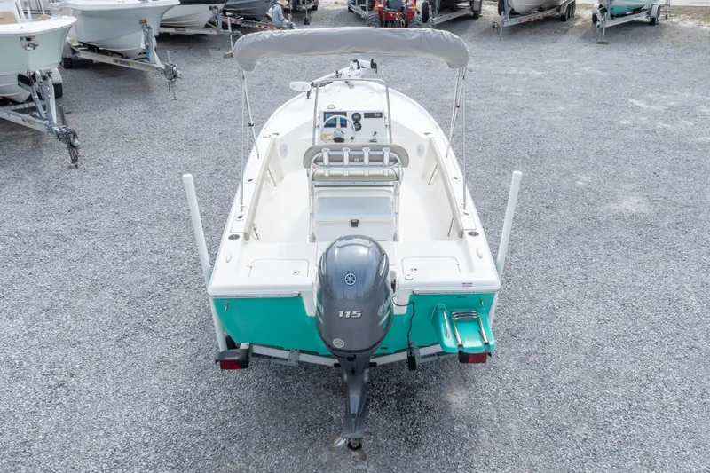 Slide: The Image of 2023 Key West 188 Bay Reef boat with Yamaha 115 engine, parked on gravel. - 35