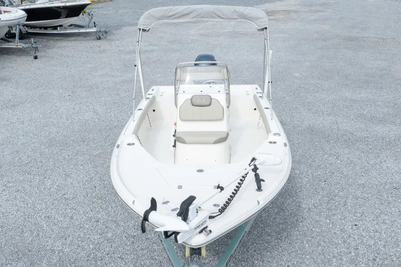 Slide: The Image of 2023 Key West 188 Bay Reef boat with bimini top on gravel lot. - 5