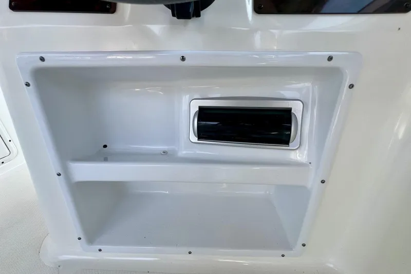 Slide: The Image of Storage compartment on a 2013 Hurricane SunDeck 187 OB boat. - 28