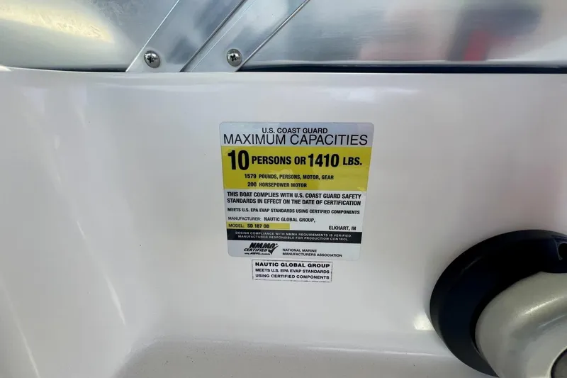 Slide: The Image of 2013 Hurricane SunDeck 187 OB capacity label, 10 persons or 1410 lbs, U.S. Coast Guard compliant. - 30